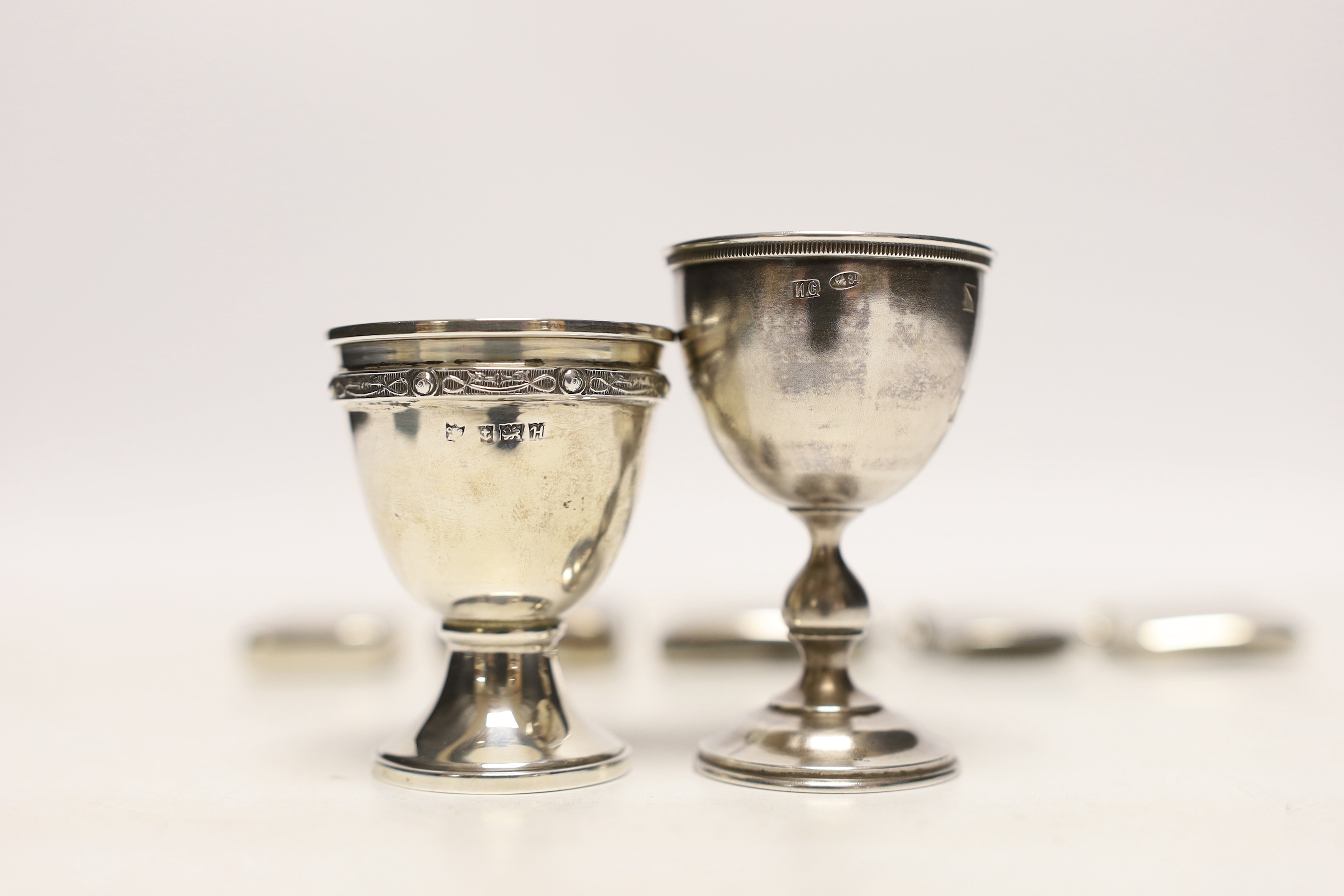 An early 20th century Russian 84 zolotnik egg cup, 69mm a later silver egg cup and five assorted silver vesta cases.